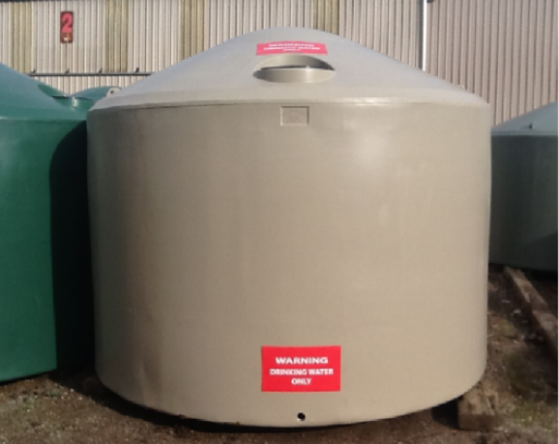 Large water tank with red warning label saying WARNING: DRINKING WATER ONLY
